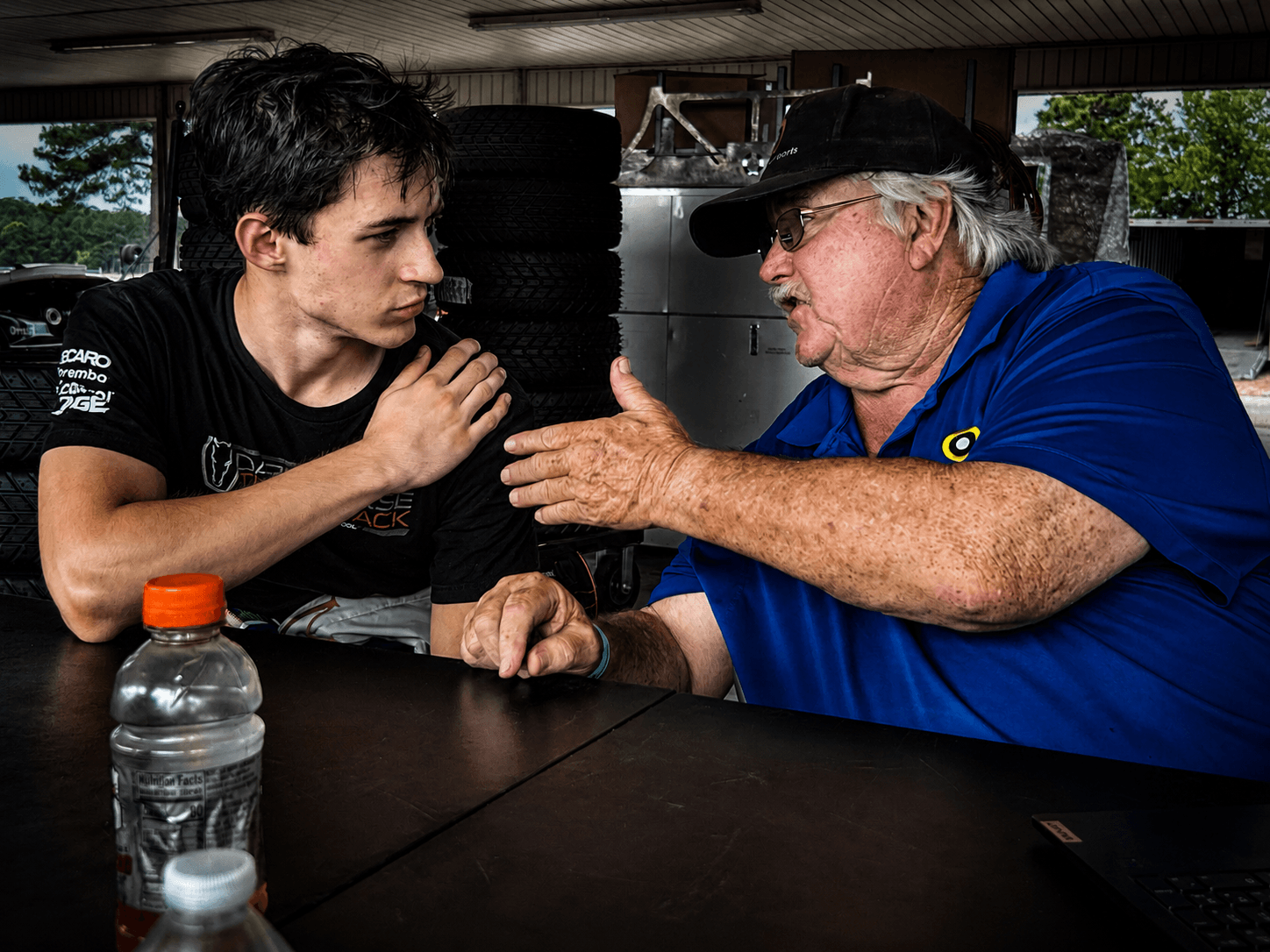 Filippo Massa in driver coach discussion during the CMP 2026 race weekend