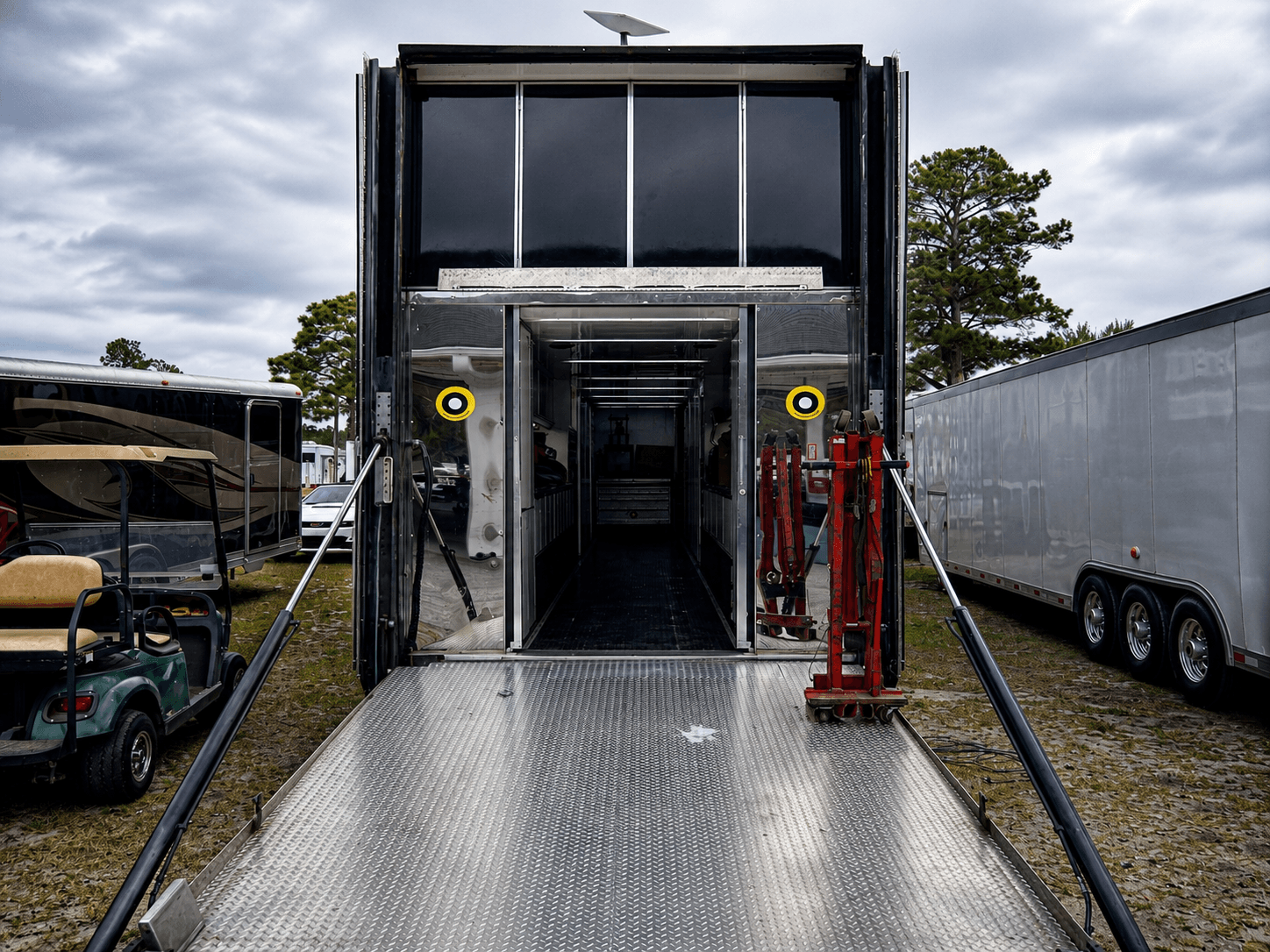 Race trailer ramp and paddock setup during Filippo Massa's CMP 2026 event