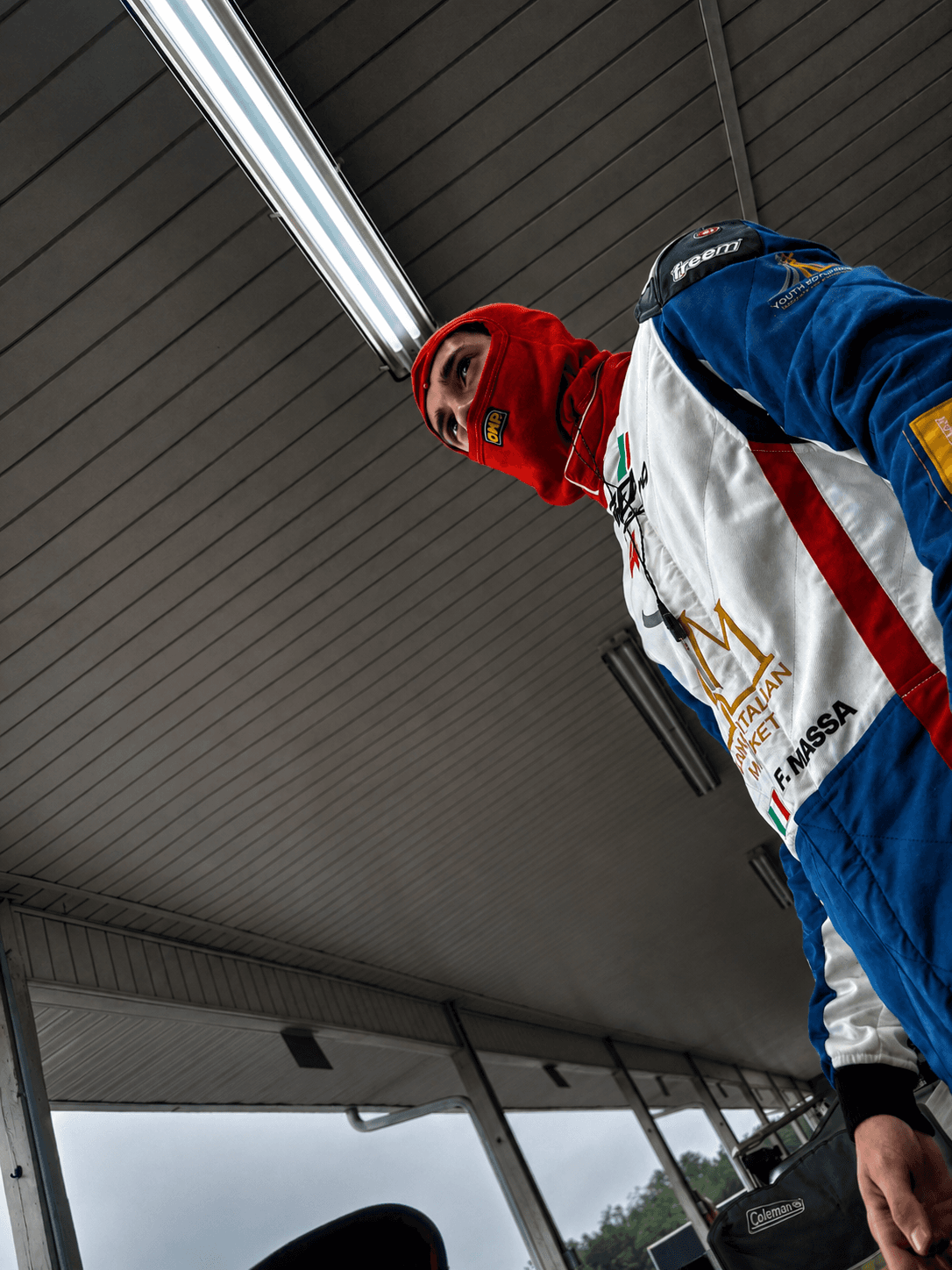 Filippo Massa in red suit during CMP 2026 pre-session preparation