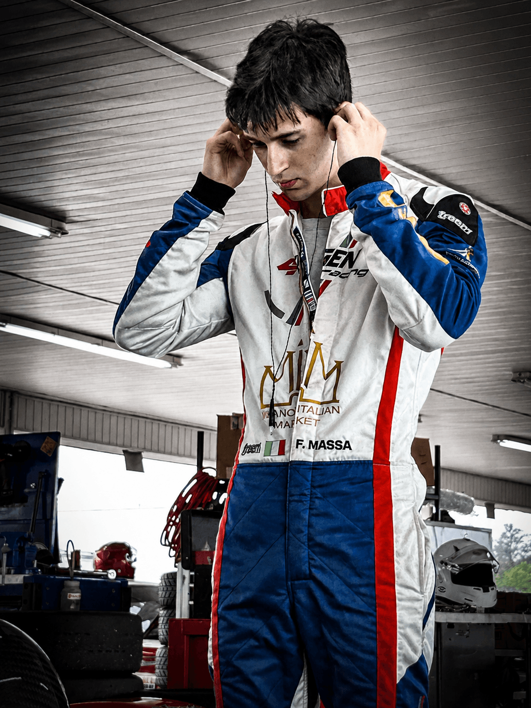 Filippo Massa preparing an earpiece before a CMP 2026 session