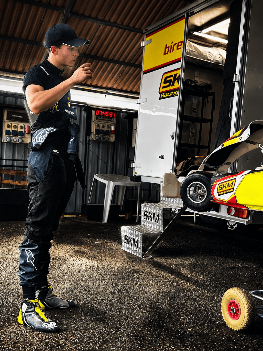 Filippo Massa preparing beside an SKM karting trailer