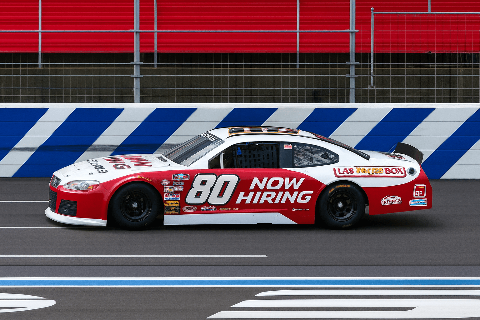 Closed-wheel stock car number 80 on an oval during development work