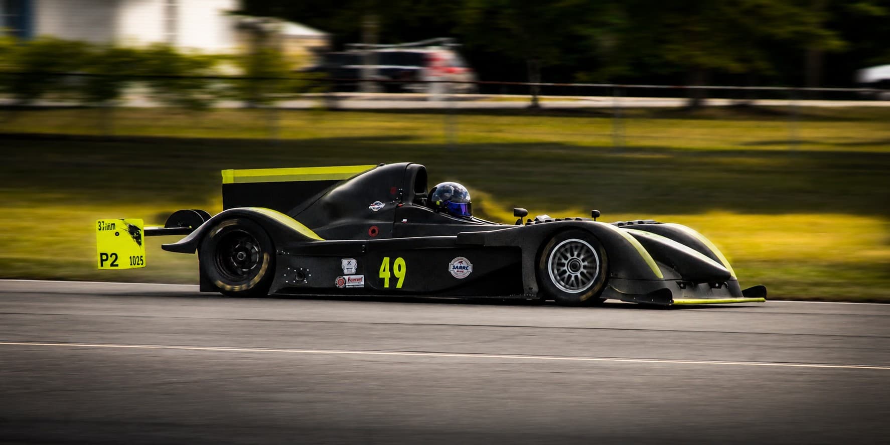 Black and yellow number 49 sports racer on track
