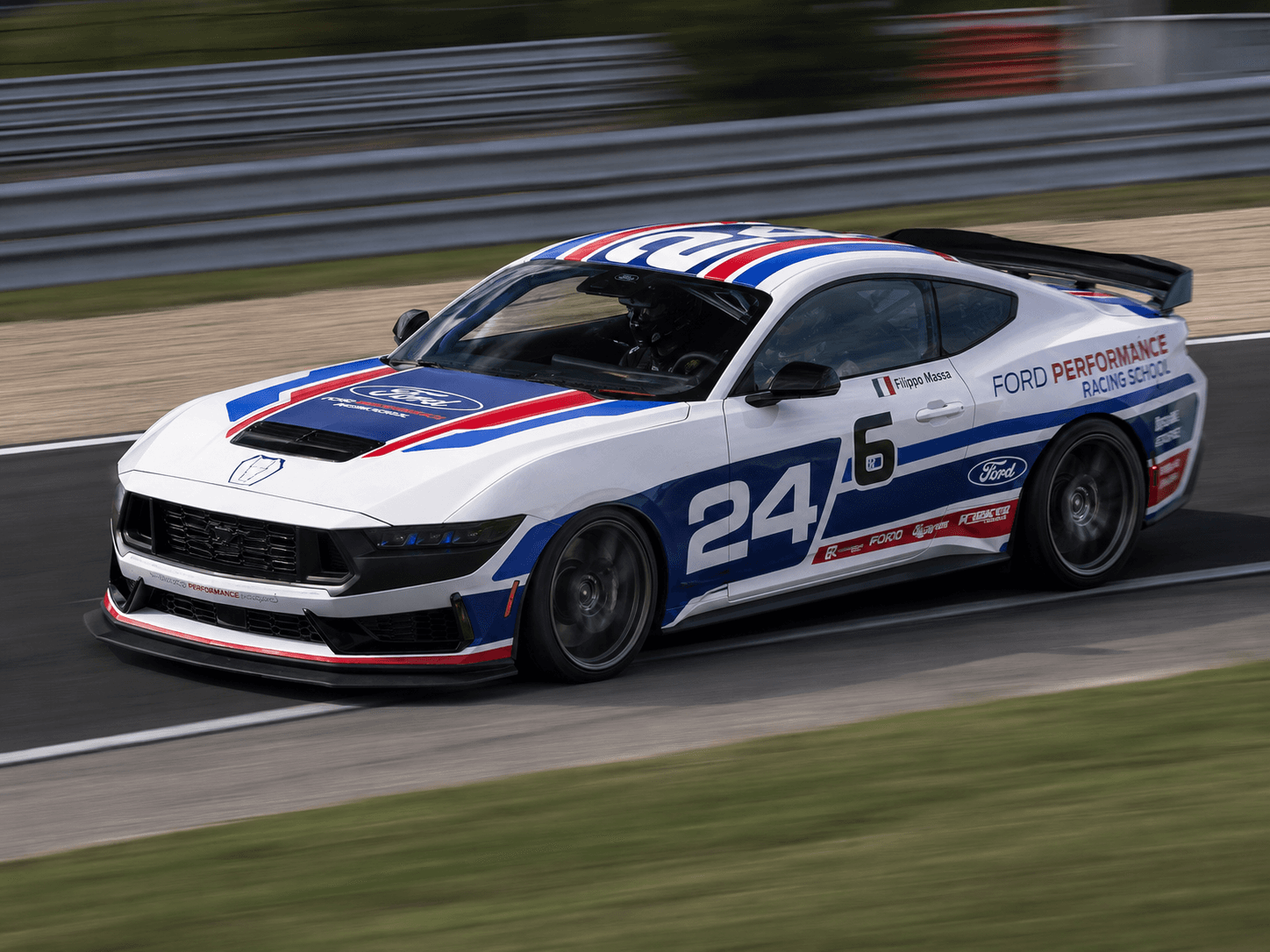 Dark Horse race car on track during driver development