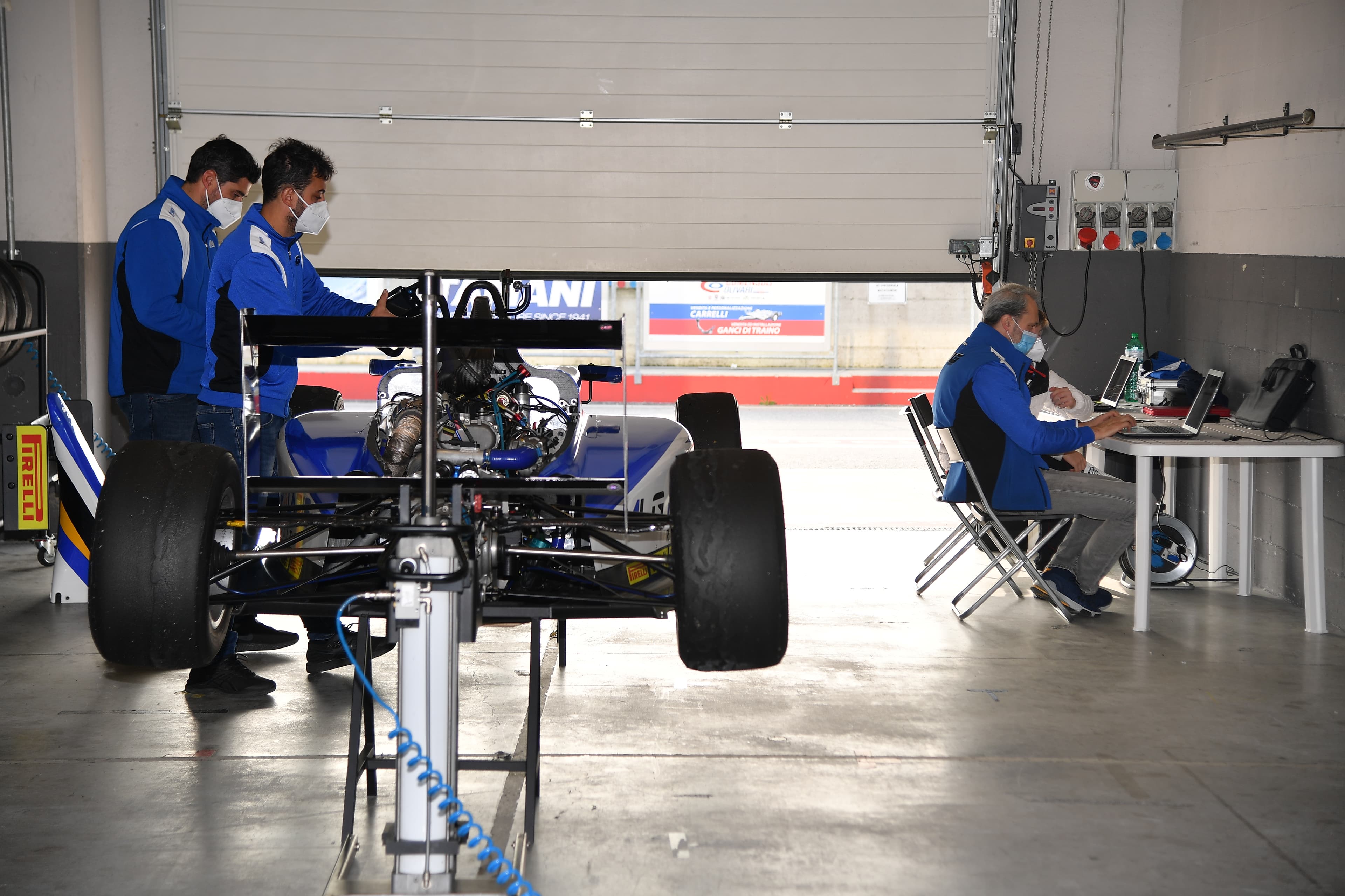 Race car garage engineering work during development preparation