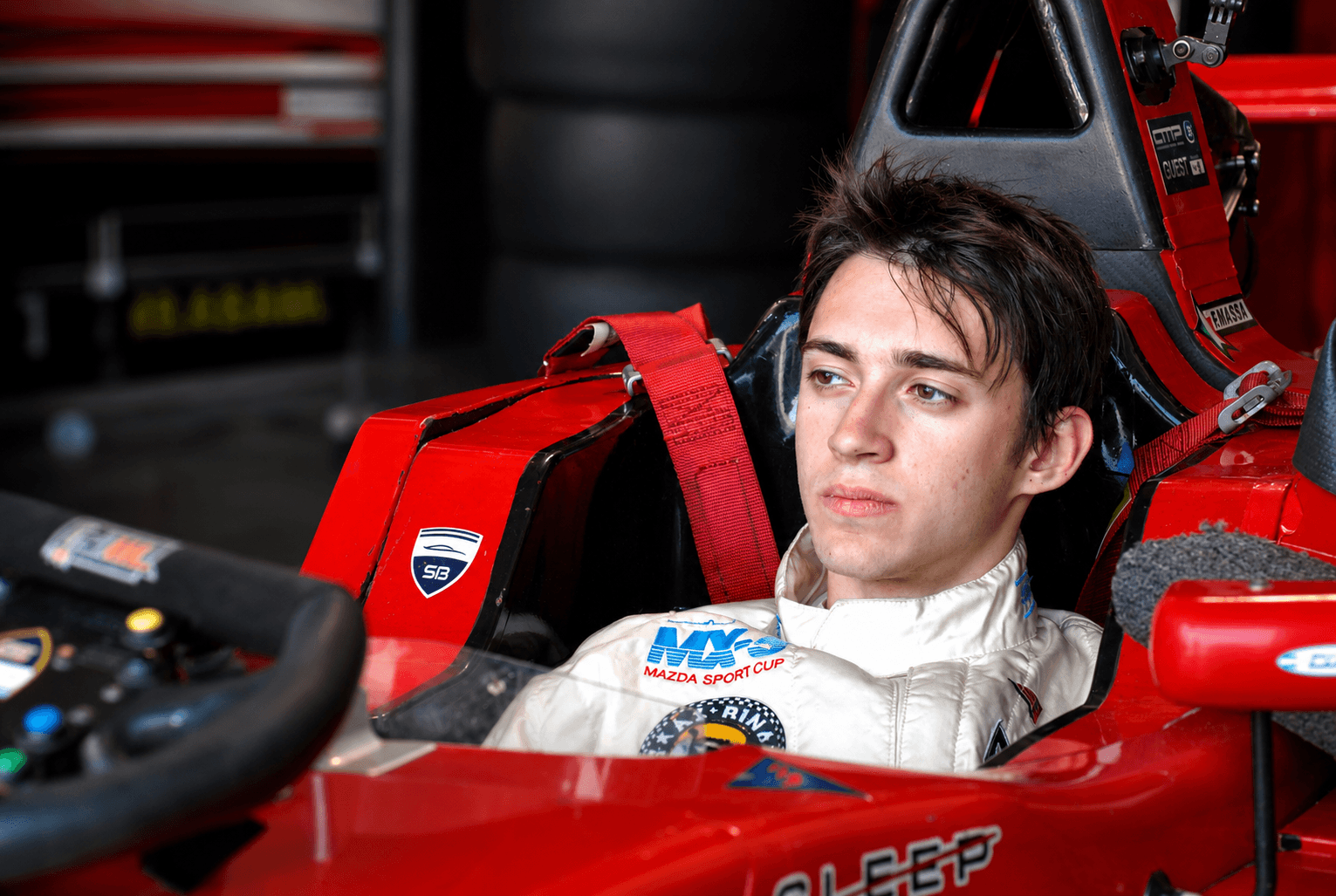 Formula car in garage during race preparation