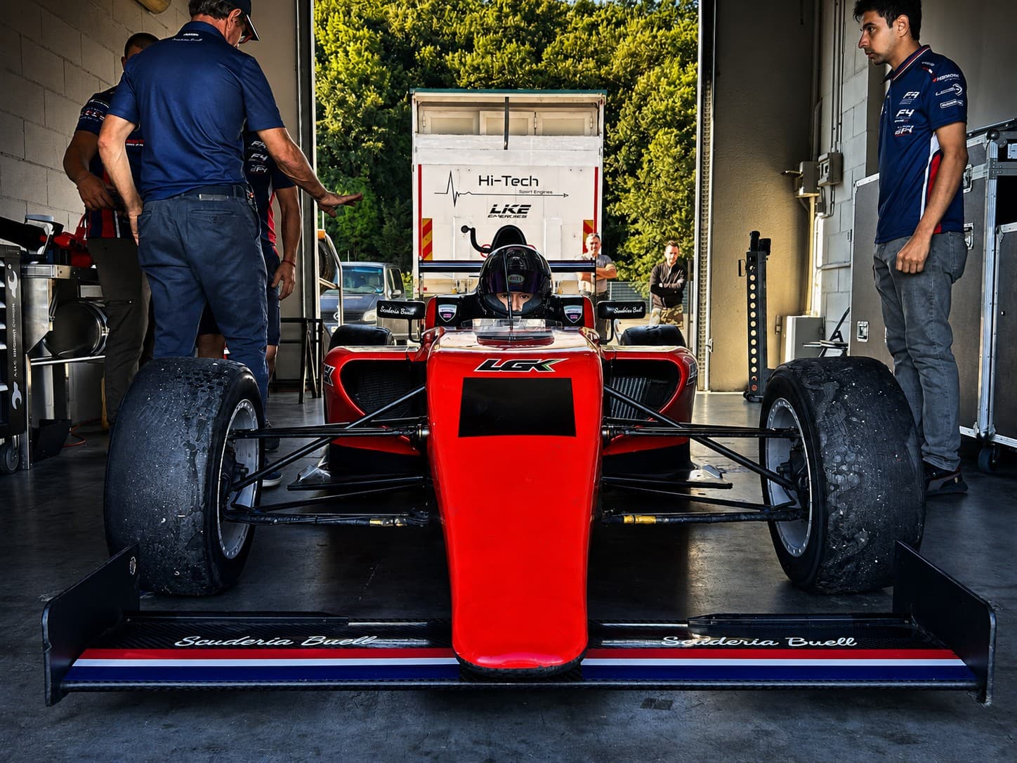 Red formula car front view prepared for track activity