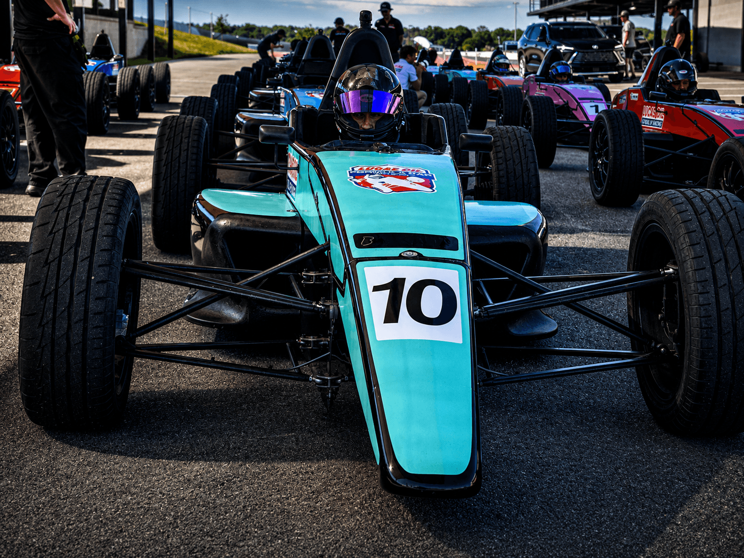 Open-wheel car number 70 on the grid before a session