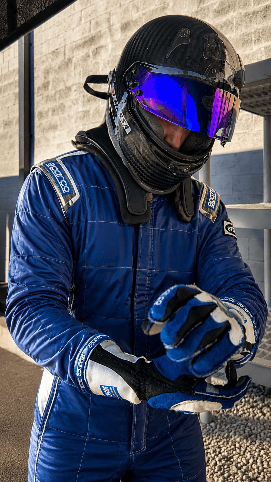Filippo Massa adjusting racing gloves before a session