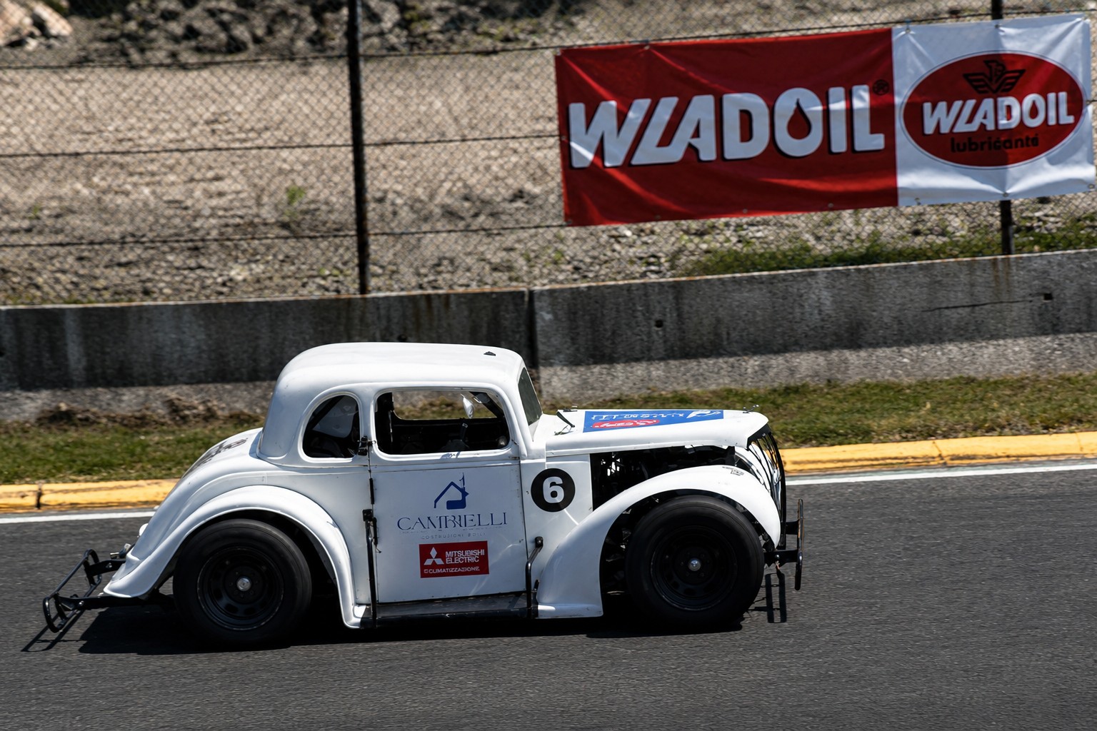 White Legends race car number 6 on track